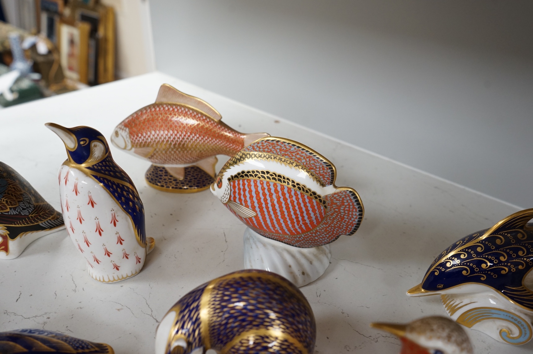 A collection of Royal Crown Derby Imari animal paperweights to include cats, fish and birds, largest 14cm high
